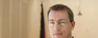 Ein Porträt von Roman Huber, ist zu sehen. Er ist Geschäftsführender Bundesvorstand.