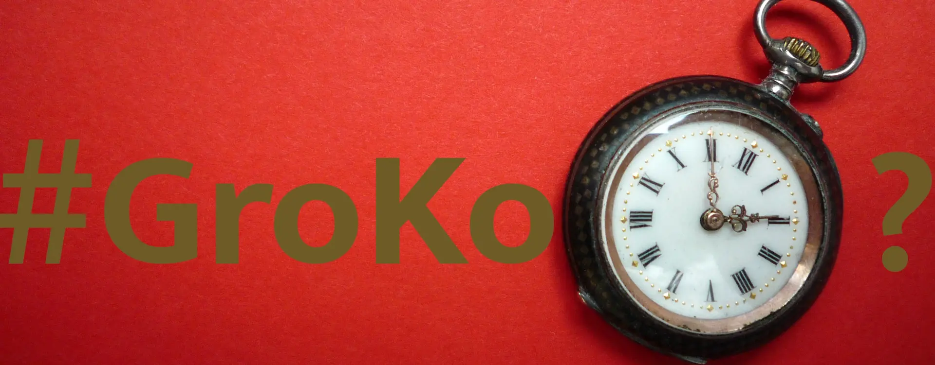 Ein roter Hintergrund mit dem Text "#GroKo?" mit einer Taschenuhr, ist zu sehen.