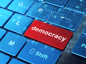 Political concept: Democracy on computer keyboard background