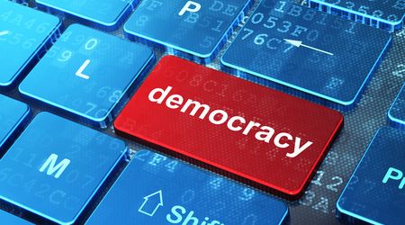 Political concept: Democracy on computer keyboard background