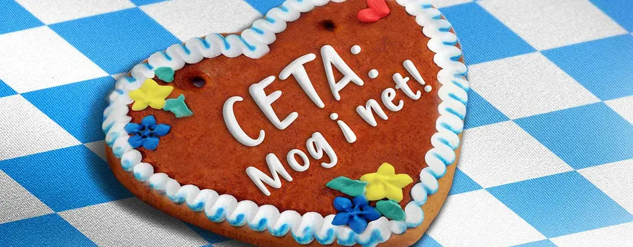 Auf dem Bild ist ein Lebkuchenherz mit der Aufschrift "CETA: Mog i net!".