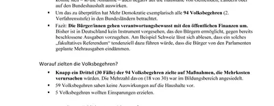 Ein Blatt mit Presseinformationen von Mehr Demokratie ist zu sehen.